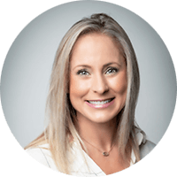 Smiling woman with blonde hair, white shirt portrait